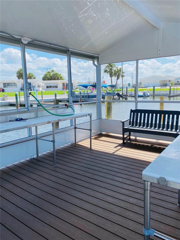 6618 Oregon Street Bradenton, FL 34207 - Photo 27 of 35 a view of a patio with a table and chairs