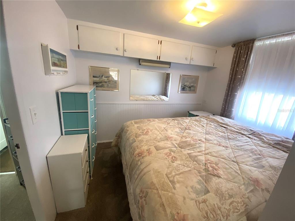 6618 Oregon Street Bradenton, FL 34207 - Photo 33 of 43 a bedroom with a bed and a window