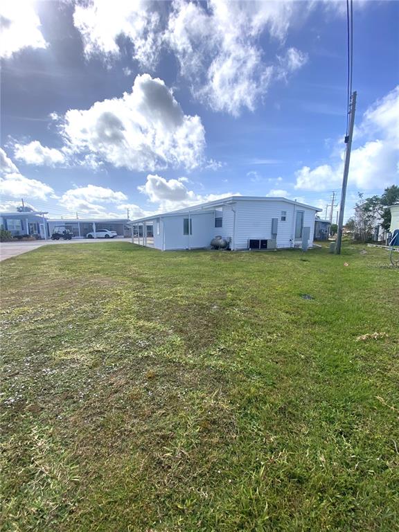 6618 Oregon Street Bradenton, FL 34207 - Photo 43 of 43 a backyard of a house with lots of green space