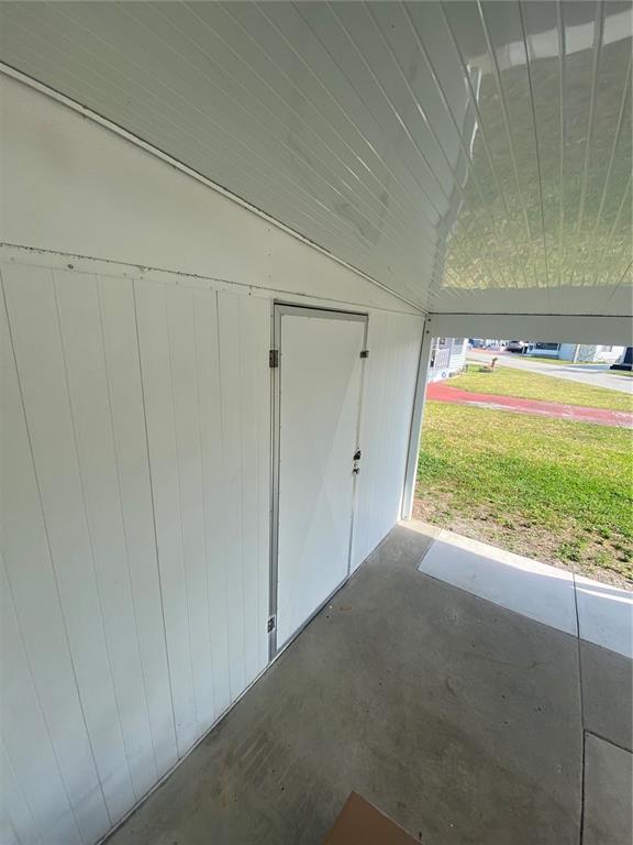 6618 Oregon Street Bradenton, FL 34207 - Photo 6 of 43 a view of an empty room with a window