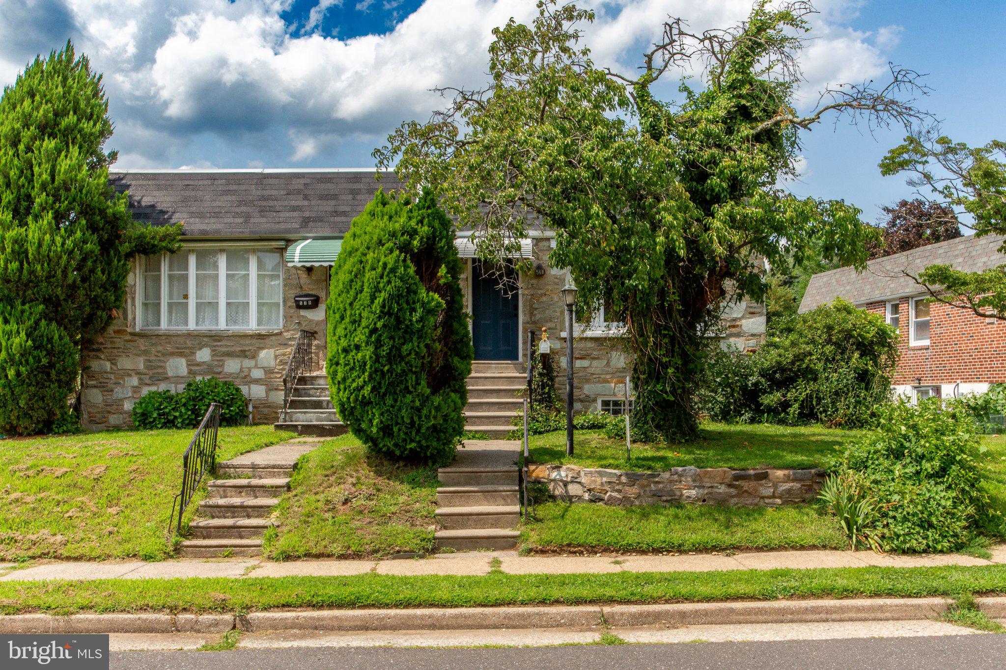 540 Wanamaker Road Jenkintown, PA 19046 - Photo 1 of 40 Charming stone facade with lush greenery.
