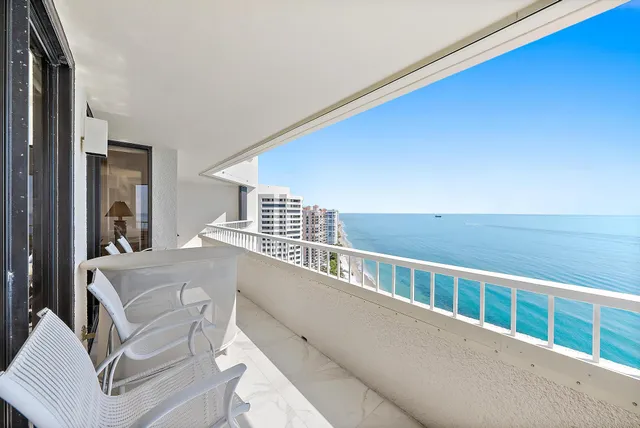 a bathroom with a granite countertop sink mirror and toilet