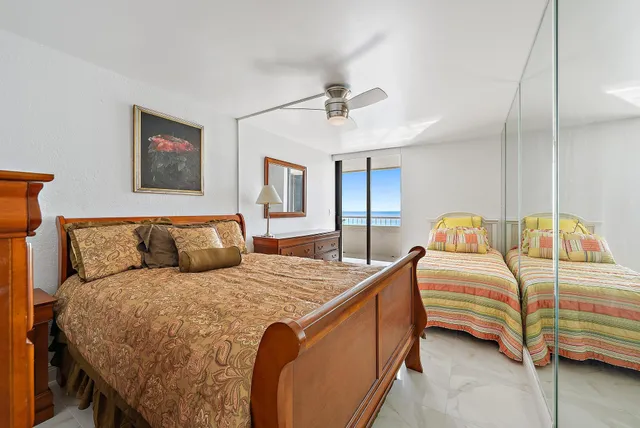 a bedroom with a bed and a mirror