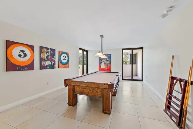 a view of kitchen with cabinets table and chairs