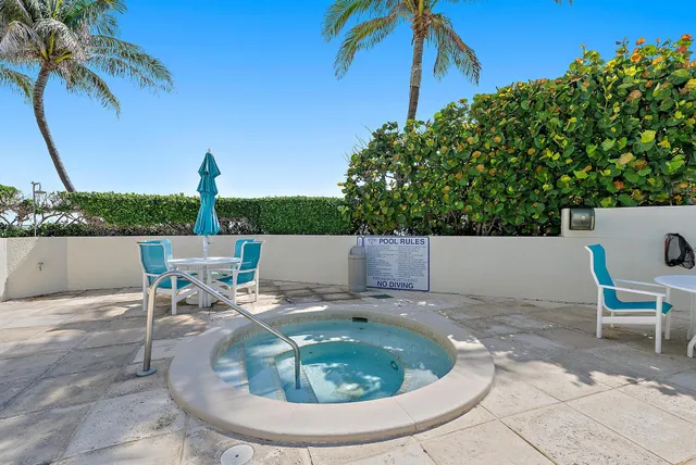 a view of swimming pool with a patio