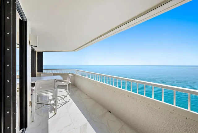 a view of balcony with furniture