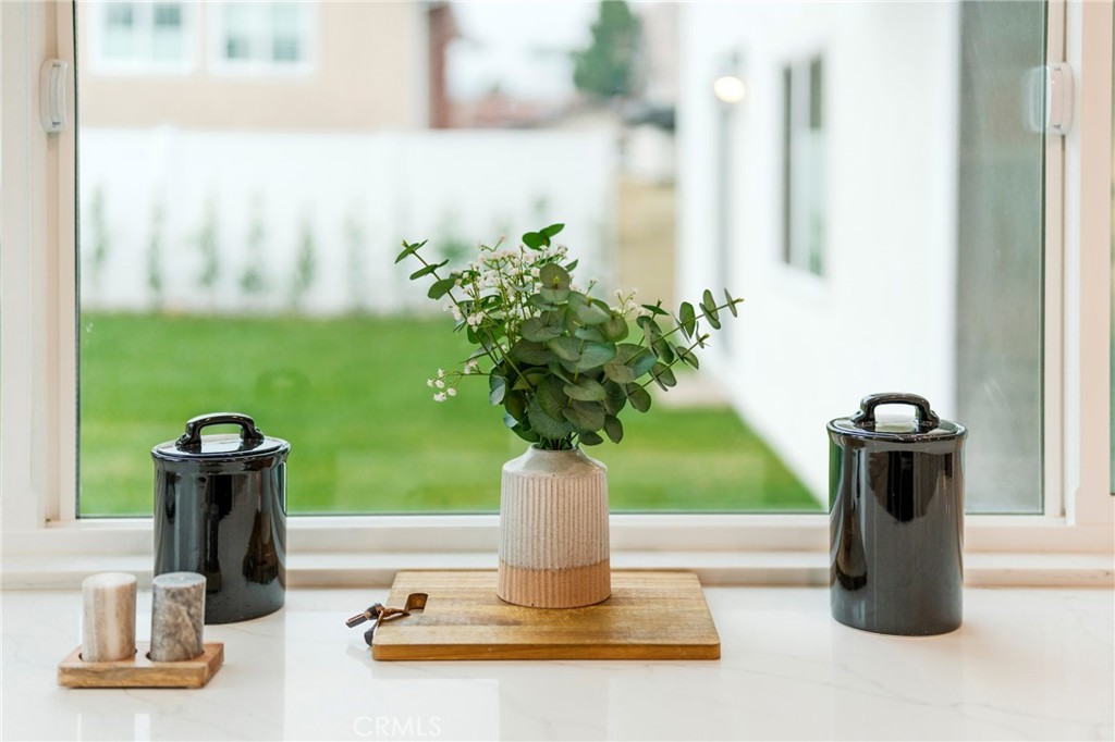 431 Devonshire Drive Brea, CA 92821 - Photo 15 of 45 a vase of flowers sitting on a table with window
