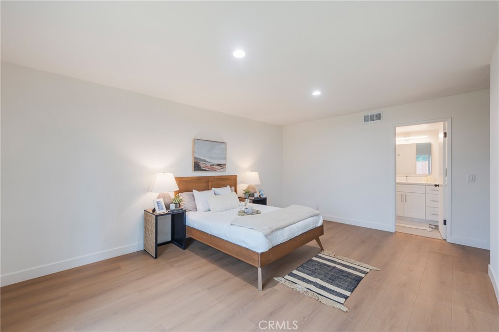 431 Devonshire Drive Brea, CA 92821 - Photo 18 of 45 a bedroom with a bed and a table in it