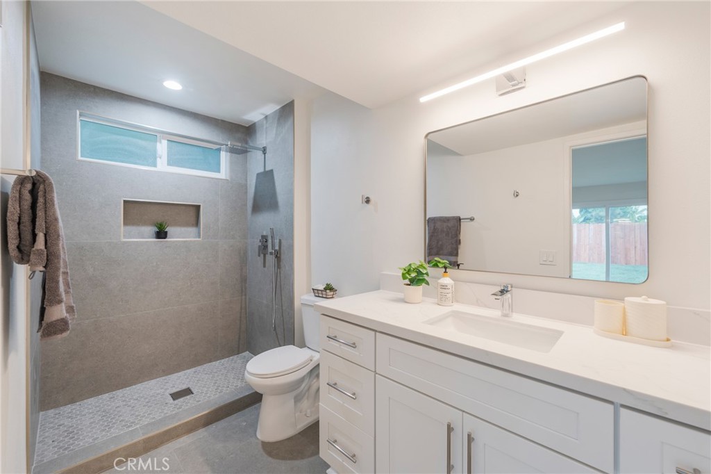 431 Devonshire Drive Brea, CA 92821 - Photo 21 of 45 a bathroom with a sink a toilet and shower