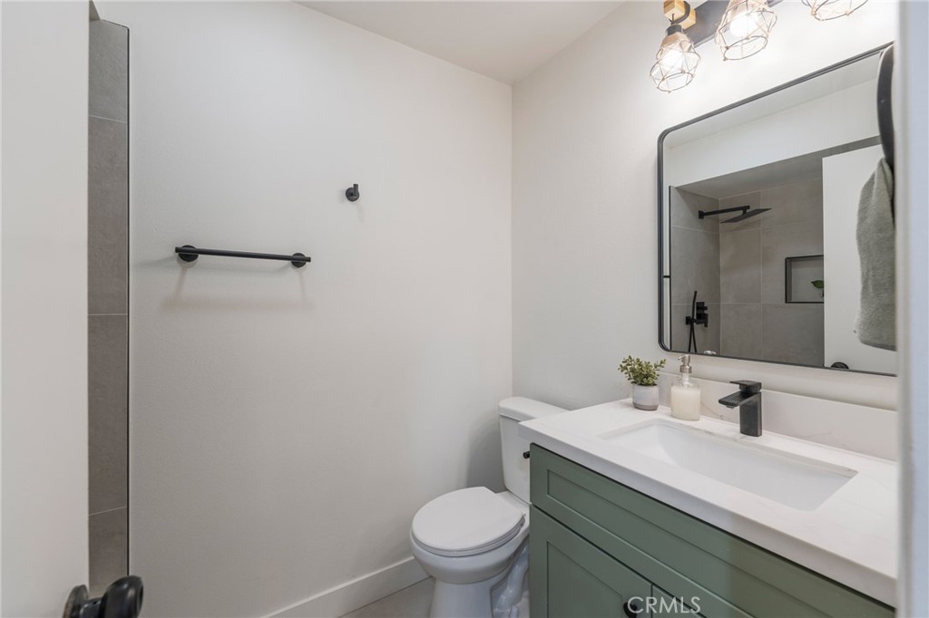 431 Devonshire Drive Brea, CA 92821 - Photo 24 of 45 a bathroom with a sink toilet and a mirror