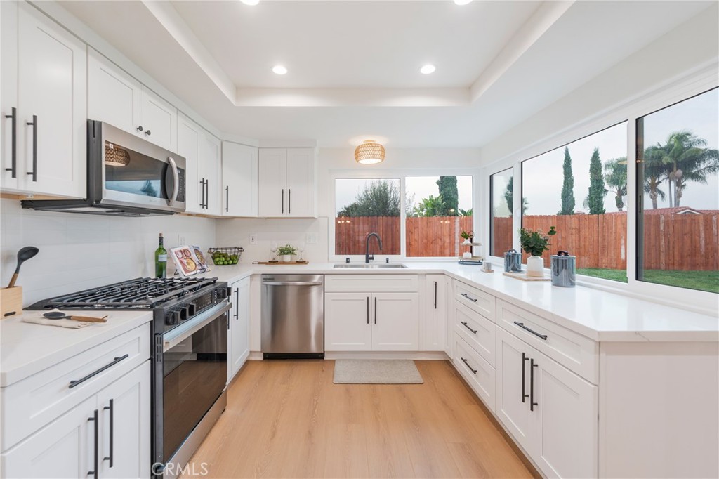 431 Devonshire Drive Brea, CA 92821 - Photo 10 of 45 a kitchen with a sink stove top oven and refrigerator