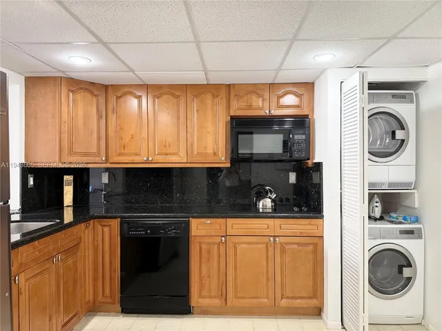 a kitchen with a stove a sink and a microwave