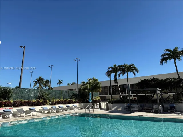 a view of swimming pool with outdoor seating