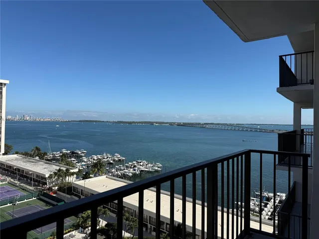 a view of a balcony with an ocean view
