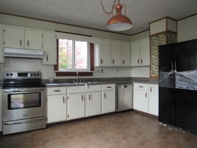 1688 Pitt Street Jennerstown, PA 15547 - Photo 11 of 23 a kitchen with granite countertop white cabinets white stainless steel appliances and a sink