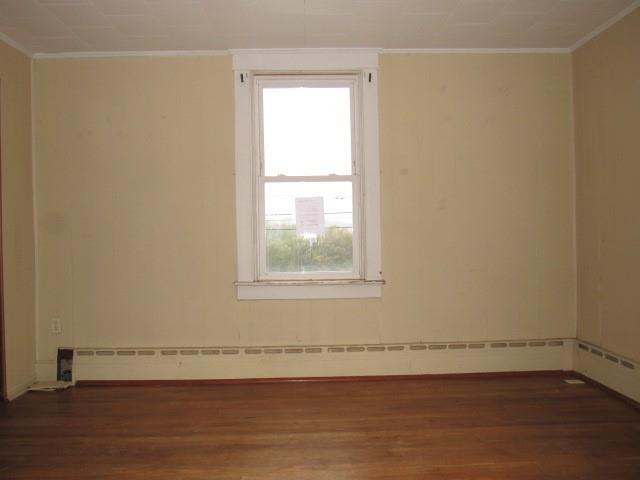 1688 Pitt Street Jennerstown, PA 15547 - Photo 12 of 23 an empty room with wooden floor and windows