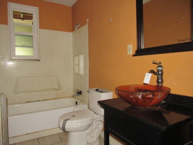 1688 Pitt Street Jennerstown, PA 15547 - Photo 13 of 23 a bathroom with a toilet a sink and bathtub