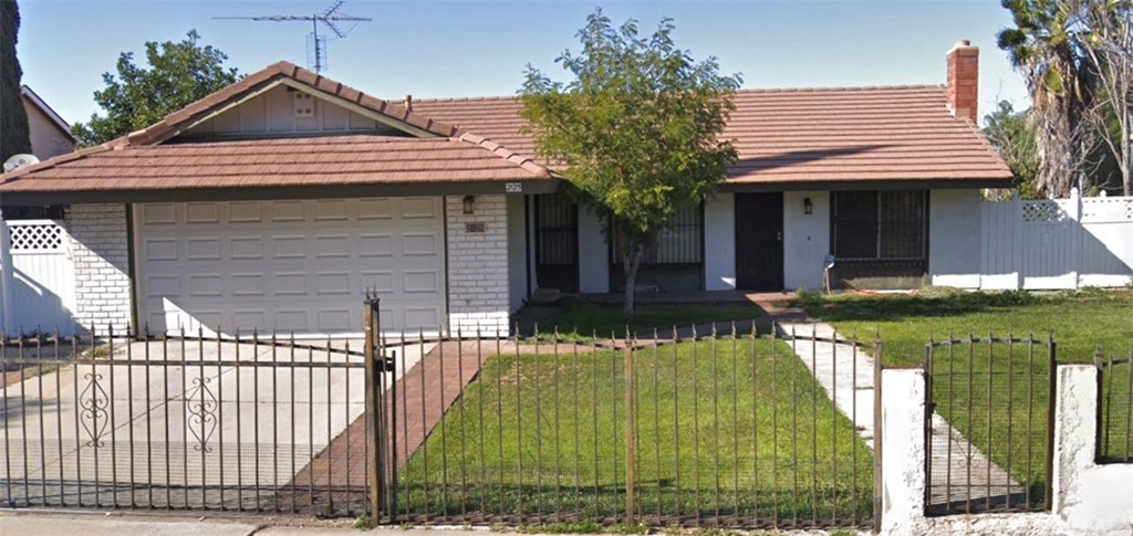 Ranch Style home with gated yard.