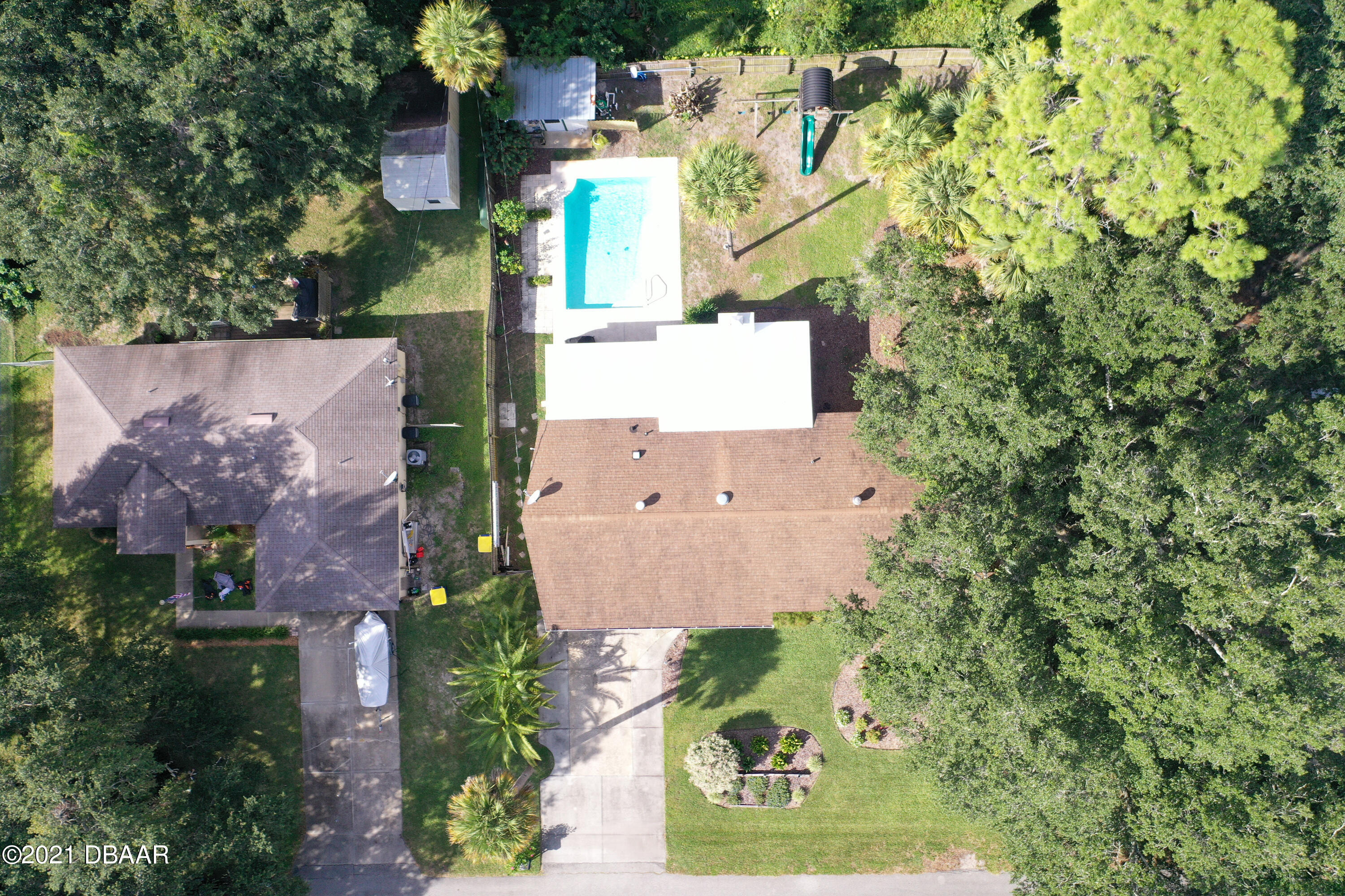 1522 Pine Tree Drive Edgewater, FL 32132 - Photo 22 of 26 an aerial view of residential houses with outdoor space and street view