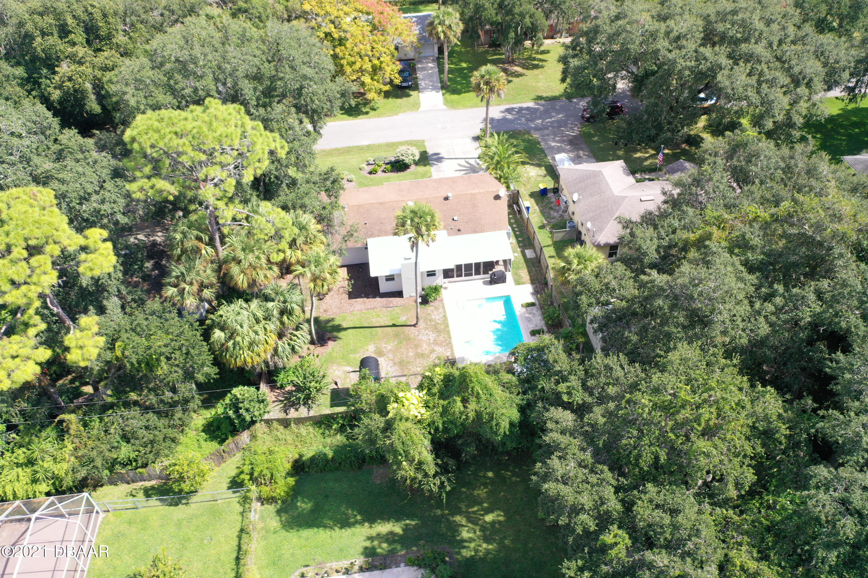 1522 Pine Tree Drive Edgewater, FL 32132 - Photo 23 of 26 an aerial view of residential house with outdoor space and trees all around