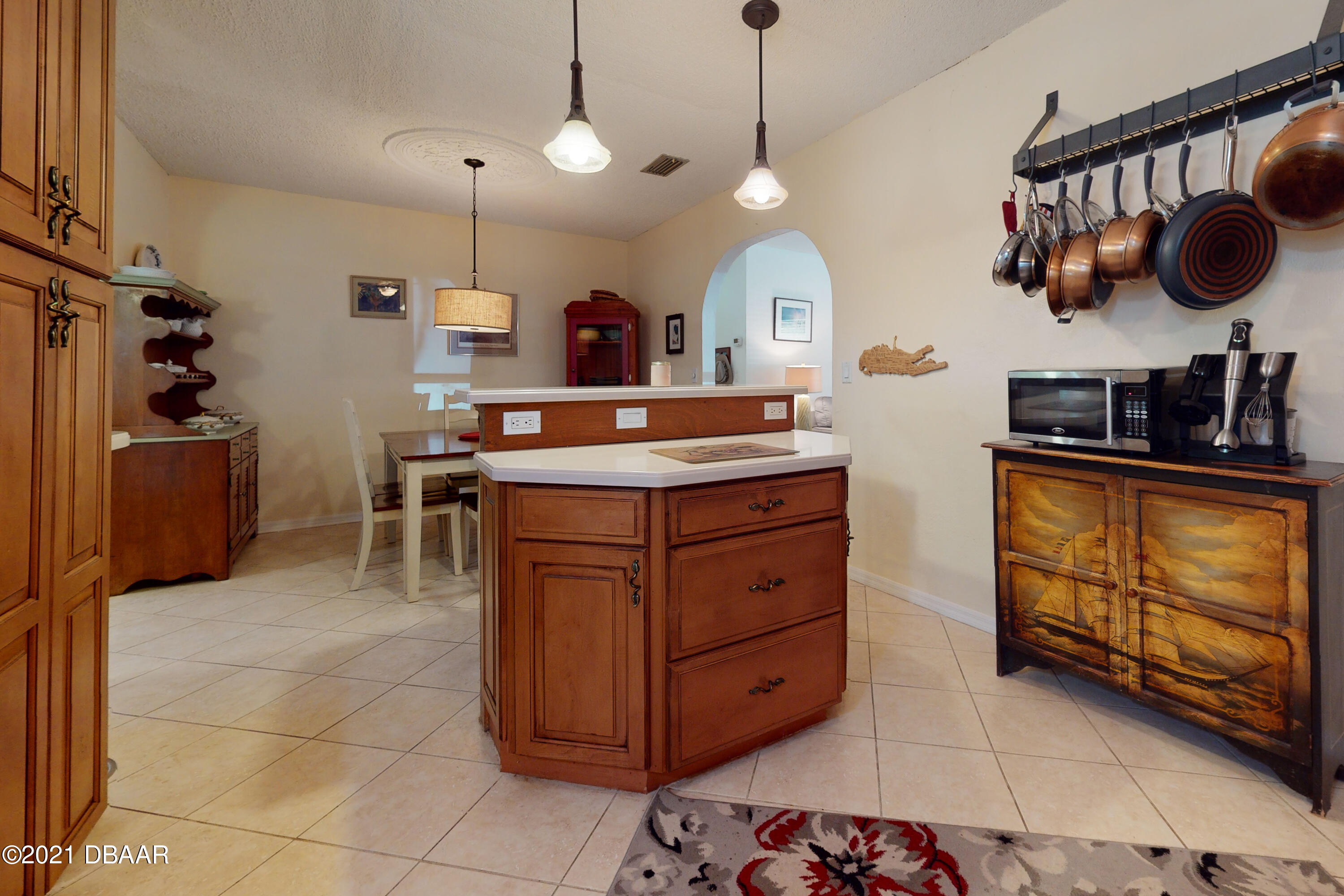 1522 Pine Tree Drive Edgewater, FL 32132 - Photo 4 of 26 a kitchen with a stove a sink and a refrigerator