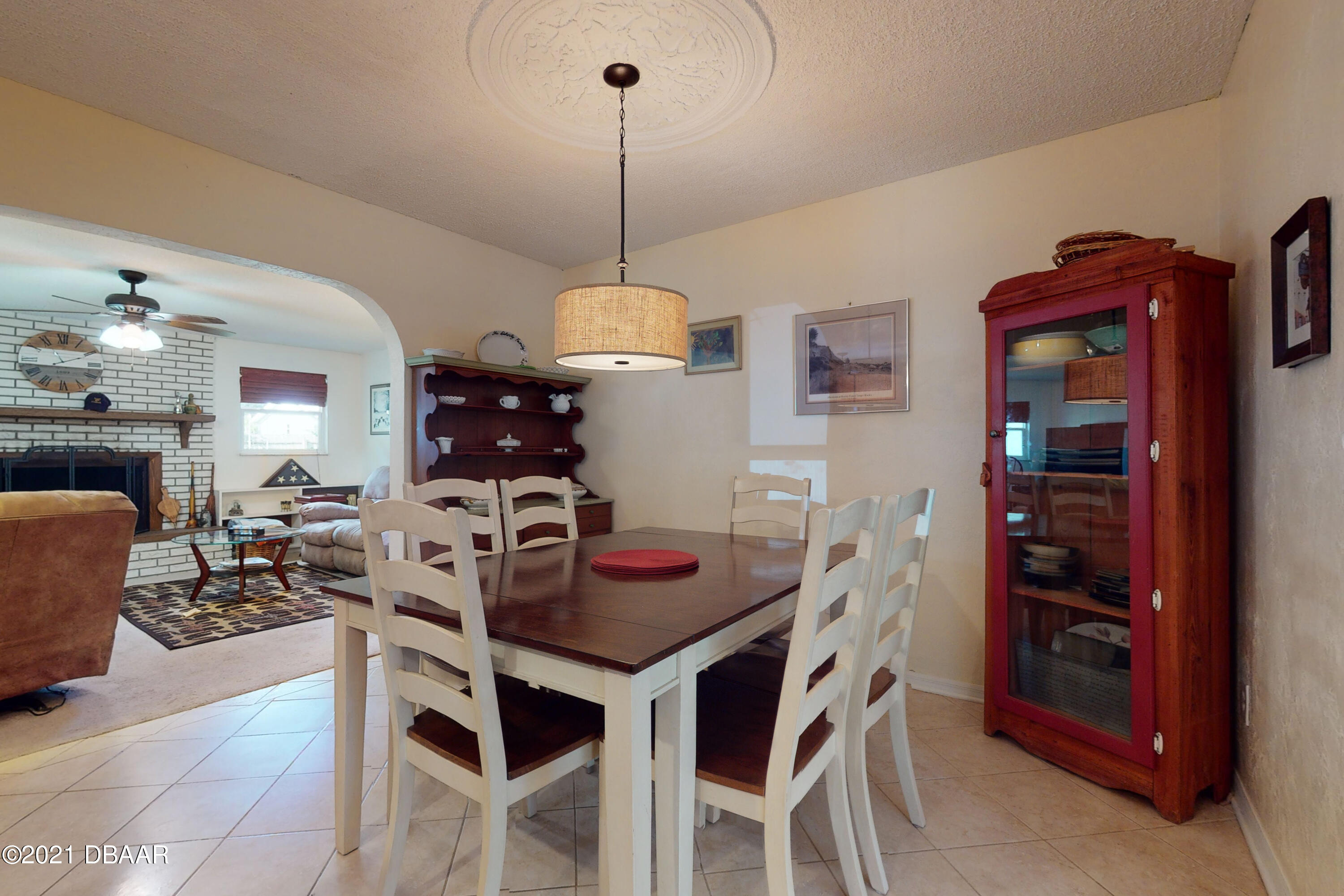 1522 Pine Tree Drive Edgewater, FL 32132 - Photo 6 of 26 a view of a dining room with furniture and chandelier