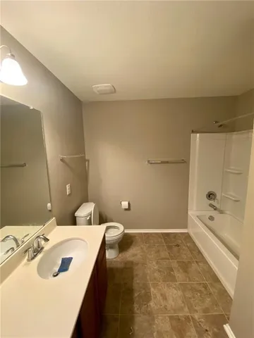 a bathroom with a bathtub and a sink