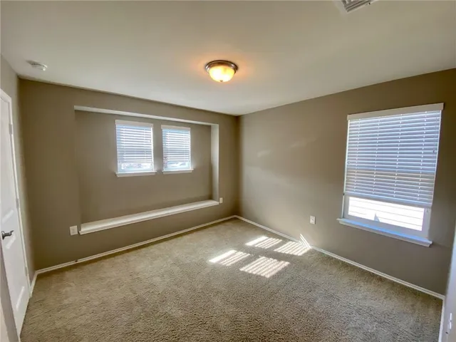 an empty room with windows