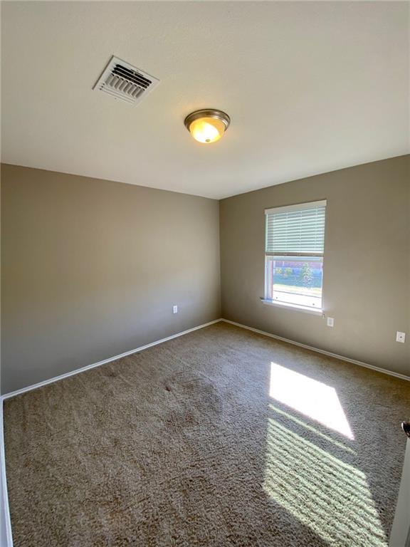 6412 Garden Rose Path Austin, TX 78754 - Photo 9 of 15 an empty room with a window