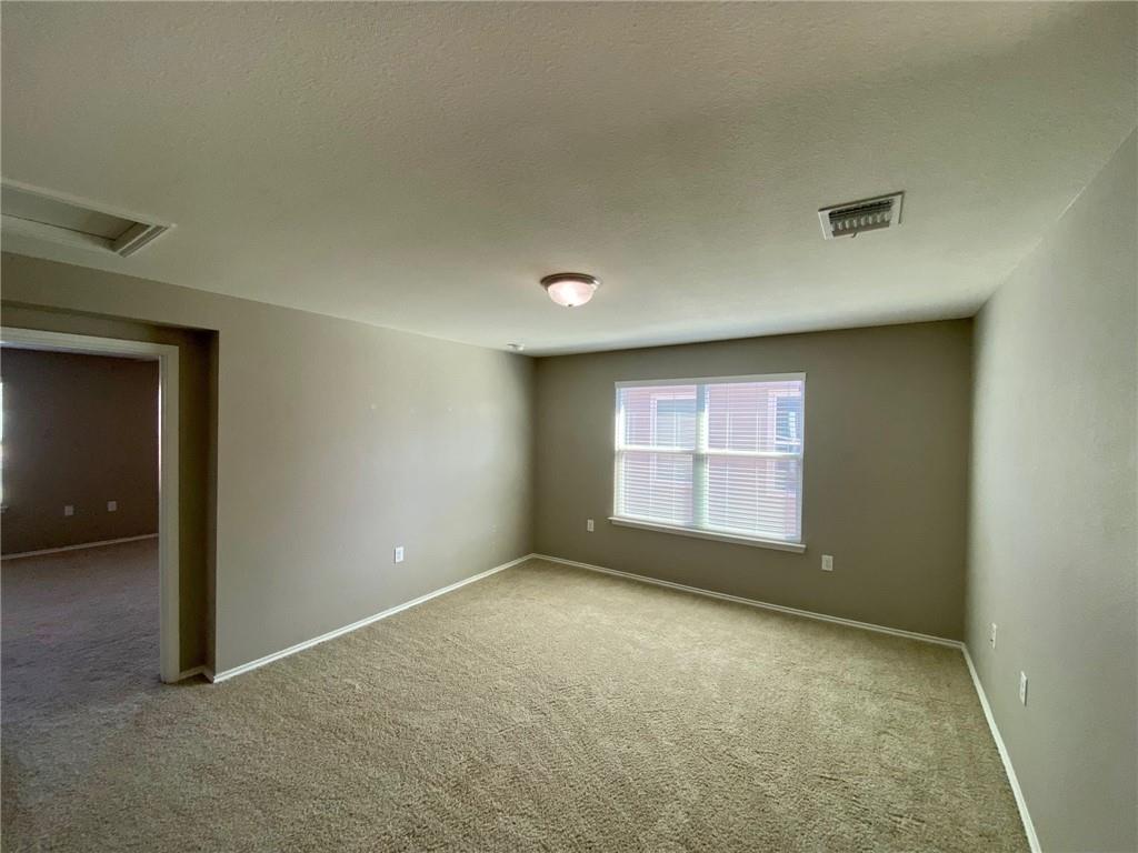 6412 Garden Rose Path Austin, TX 78754 - Photo 10 of 15 an empty room with a empty space and windows