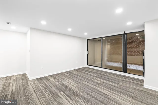 a view of hallway with wooden floor