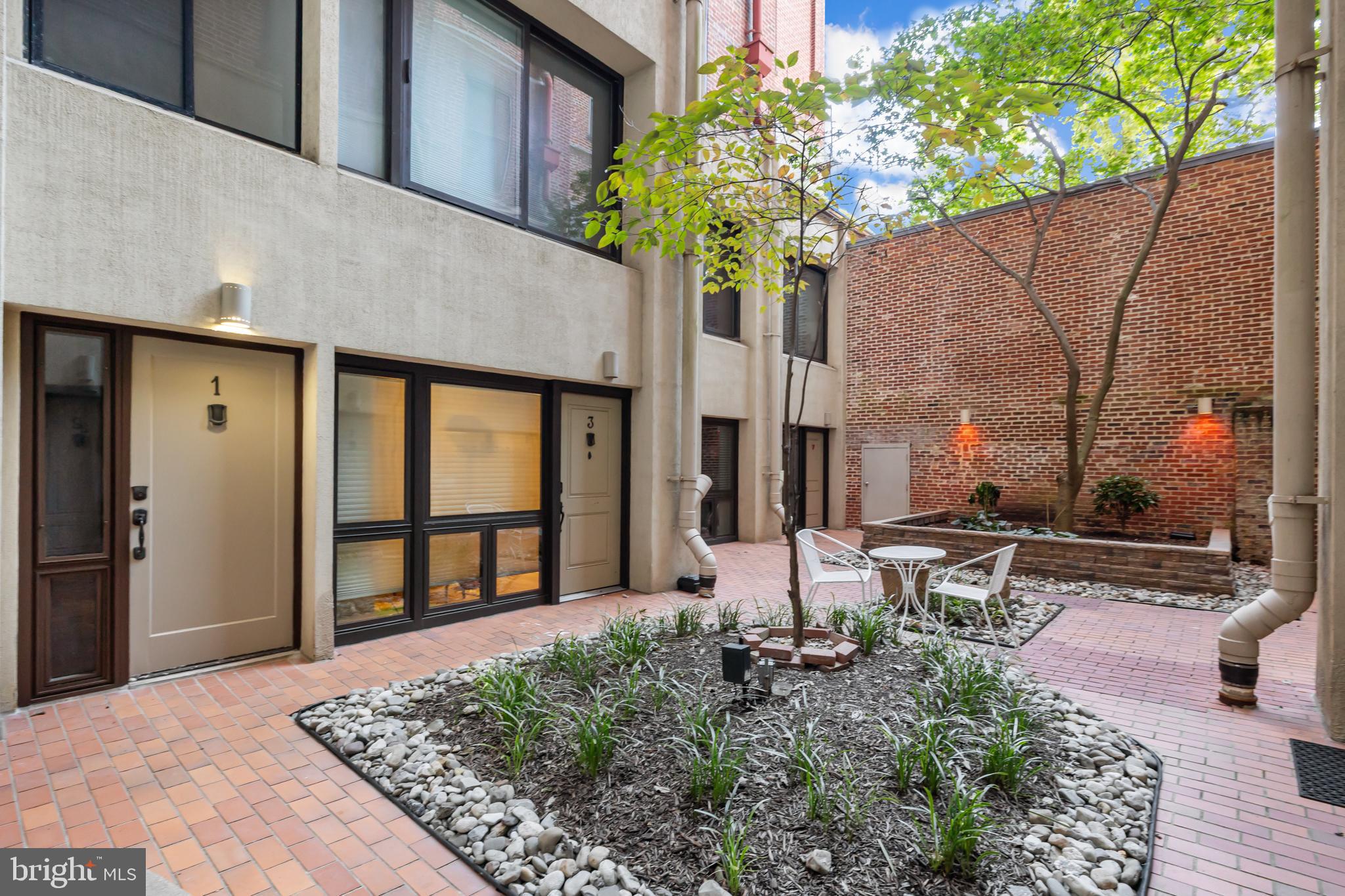 1615 Q Street Northwest, Unit T1 Washington, DC 20009 - Photo 28 of 42 a house view with a sitting space and garden space