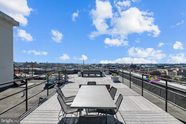 a view of a terrace with furniture and stove