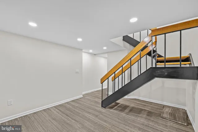 a view of entryway with wooden floor and stairs