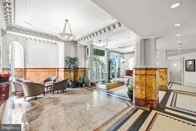 a front view of a building with retail shops