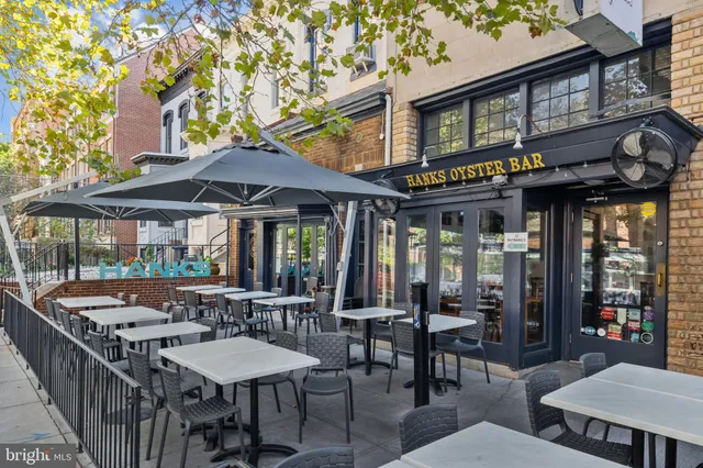 a view of a building with sitting area