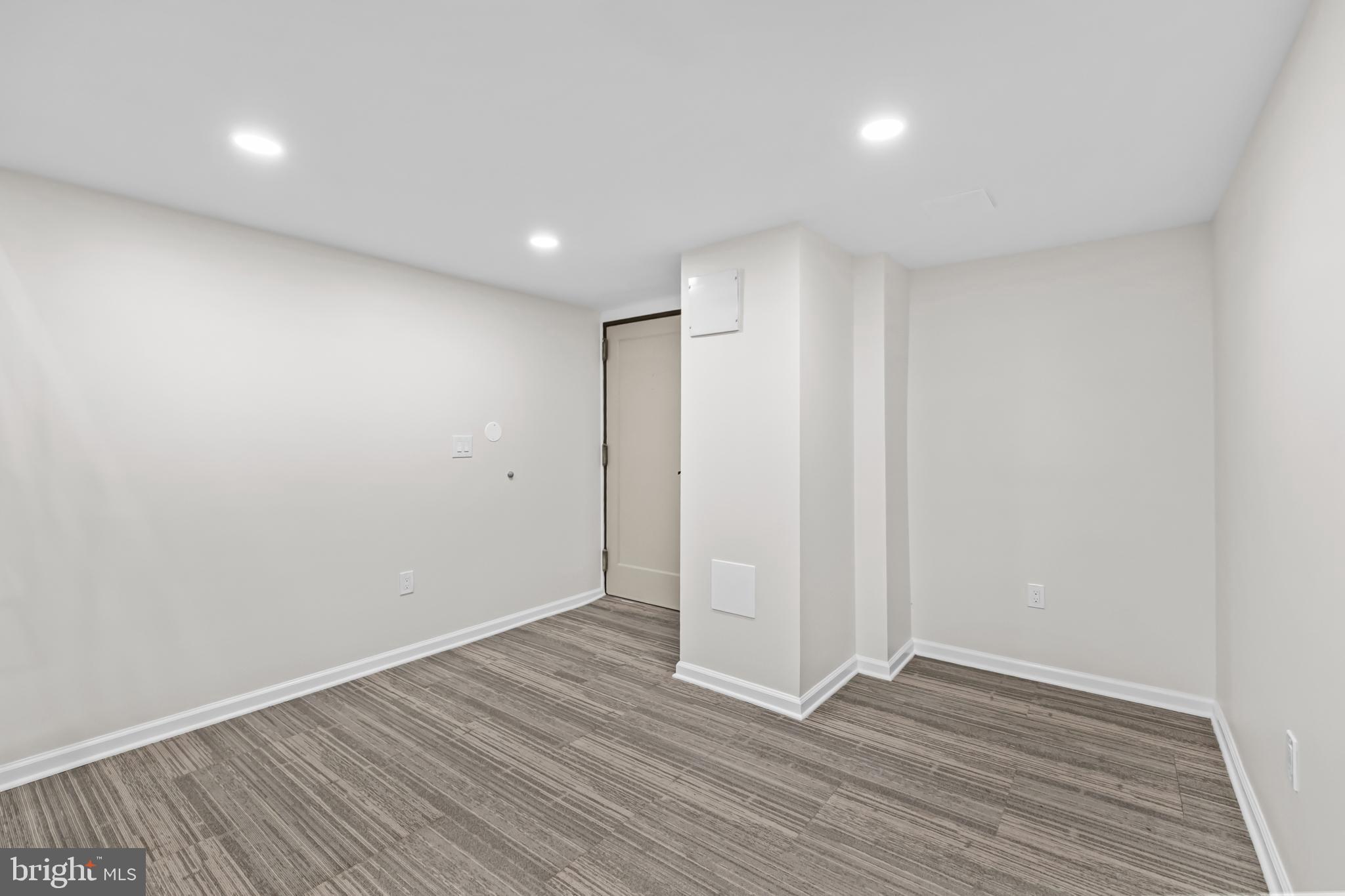 1615 Q Street Northwest, Unit T1 Washington, DC 20009 - Photo 5 of 42 a view of an empty room with wooden floor