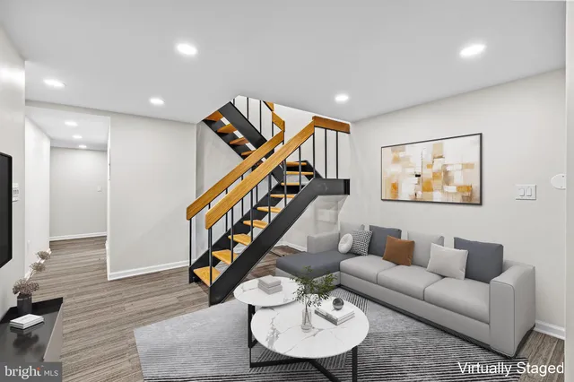 a room with stairs and wooden floor