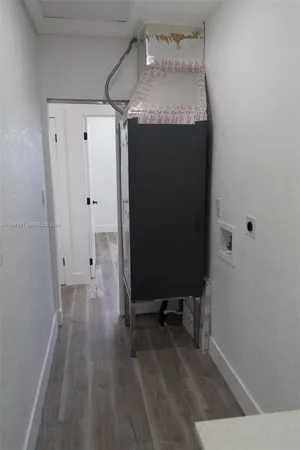 a room with a sink and a mirror