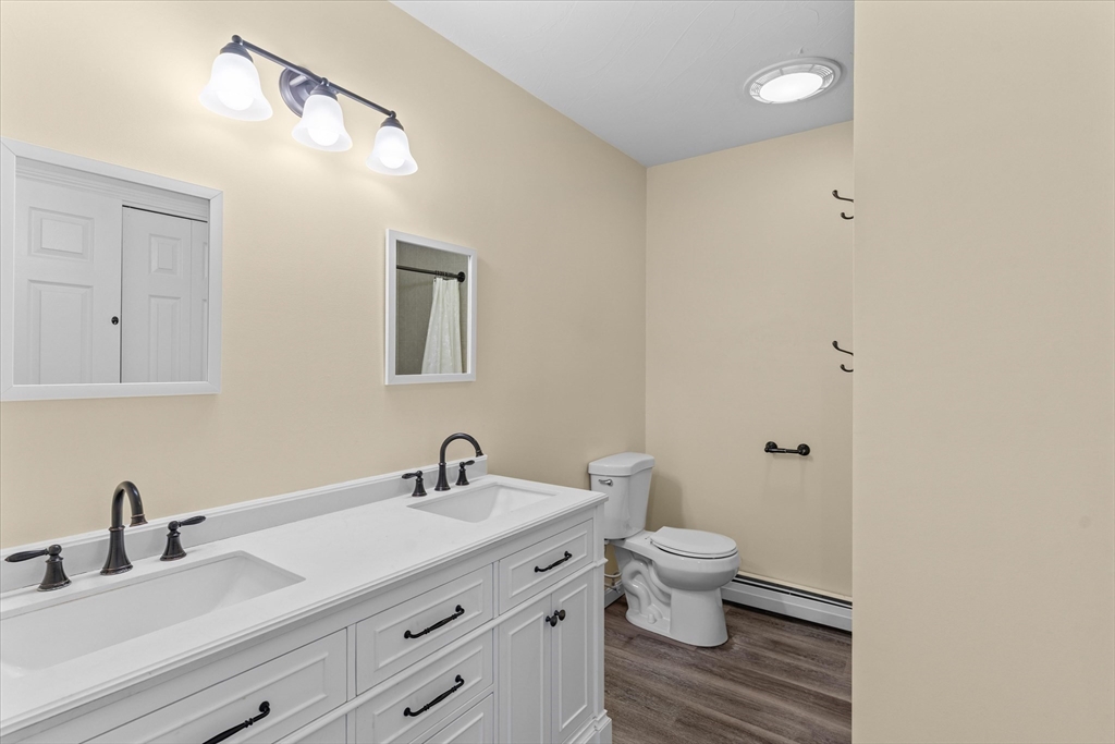 12 Easter Brook Road Lunenburg, MA 01462 - Photo 19 of 41 a bathroom with a granite countertop sink a toilet and a mirror