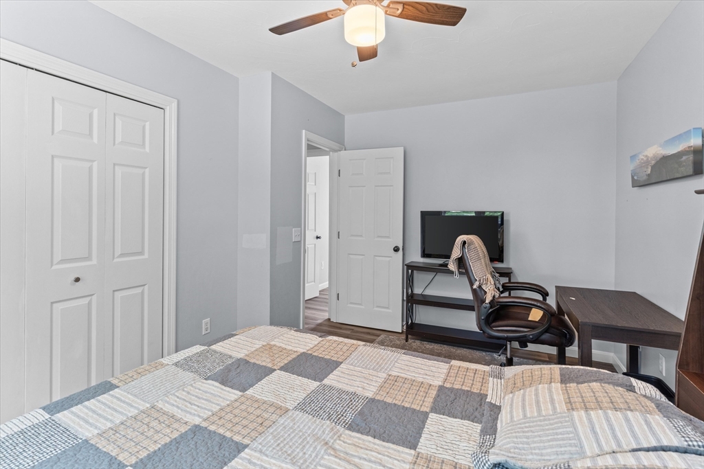 12 Easter Brook Road Lunenburg, MA 01462 - Photo 21 of 41 a bedroom with a bed and a chandelier