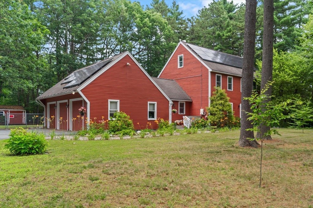 12 Easter Brook Road Lunenburg, MA 01462 - Photo 3 of 41 a view of a yard in front of a house with large windows