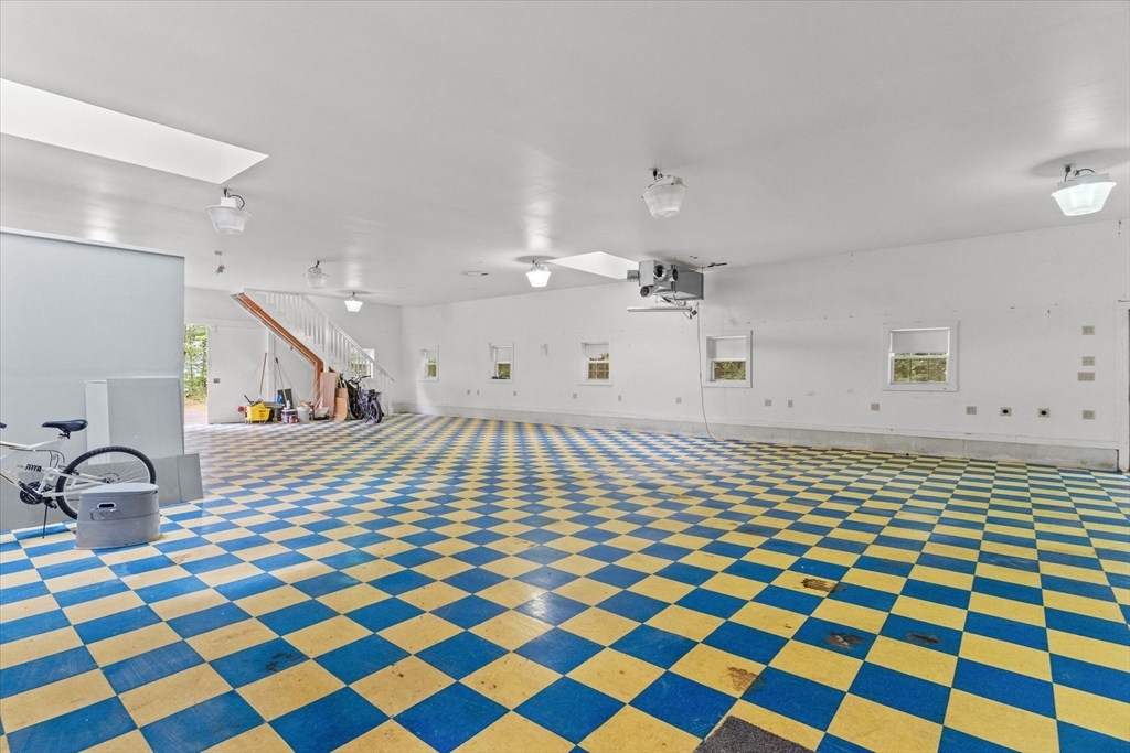 12 Easter Brook Road Lunenburg, MA 01462 - Photo 36 of 41 a living room with a black white checkered floor with a black white checkered floor