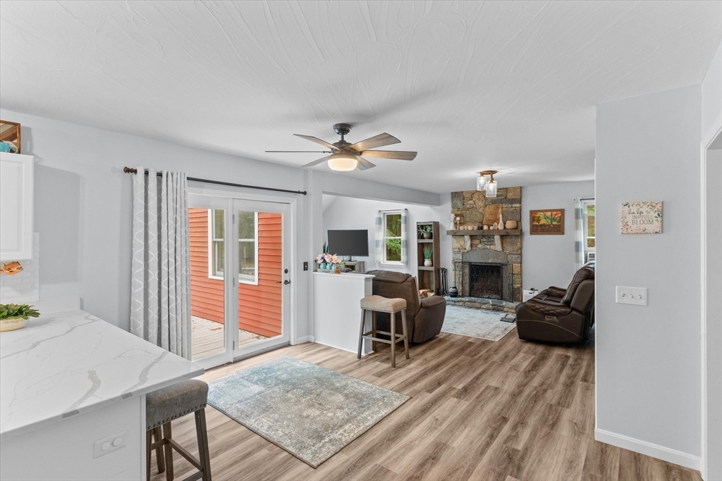 12 Easter Brook Road Lunenburg, MA 01462 - Photo 8 of 41 a living room with furniture a flat screen tv and a table