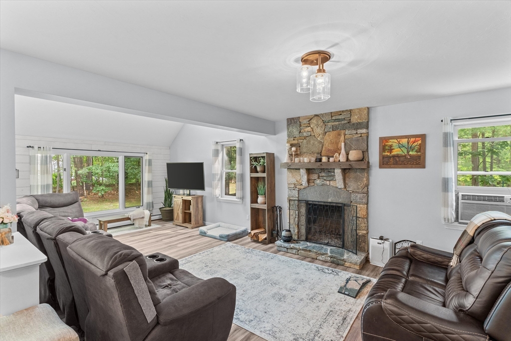 12 Easter Brook Road Lunenburg, MA 01462 - Photo 9 of 41 a living room with furniture large window and fireplace