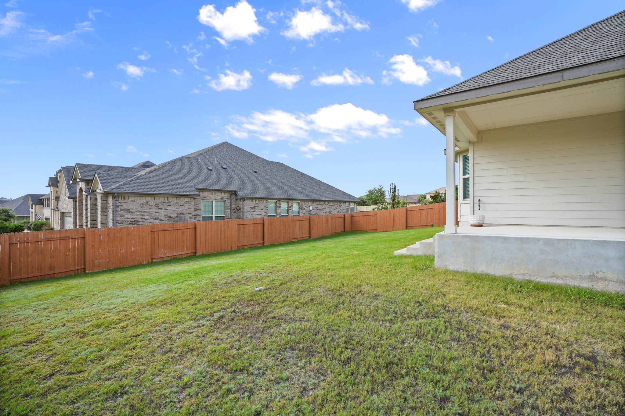 2209 Hat Bender Loop Round Rock, TX 78664 - Photo 23 of 25 a view of a backyard with a garden