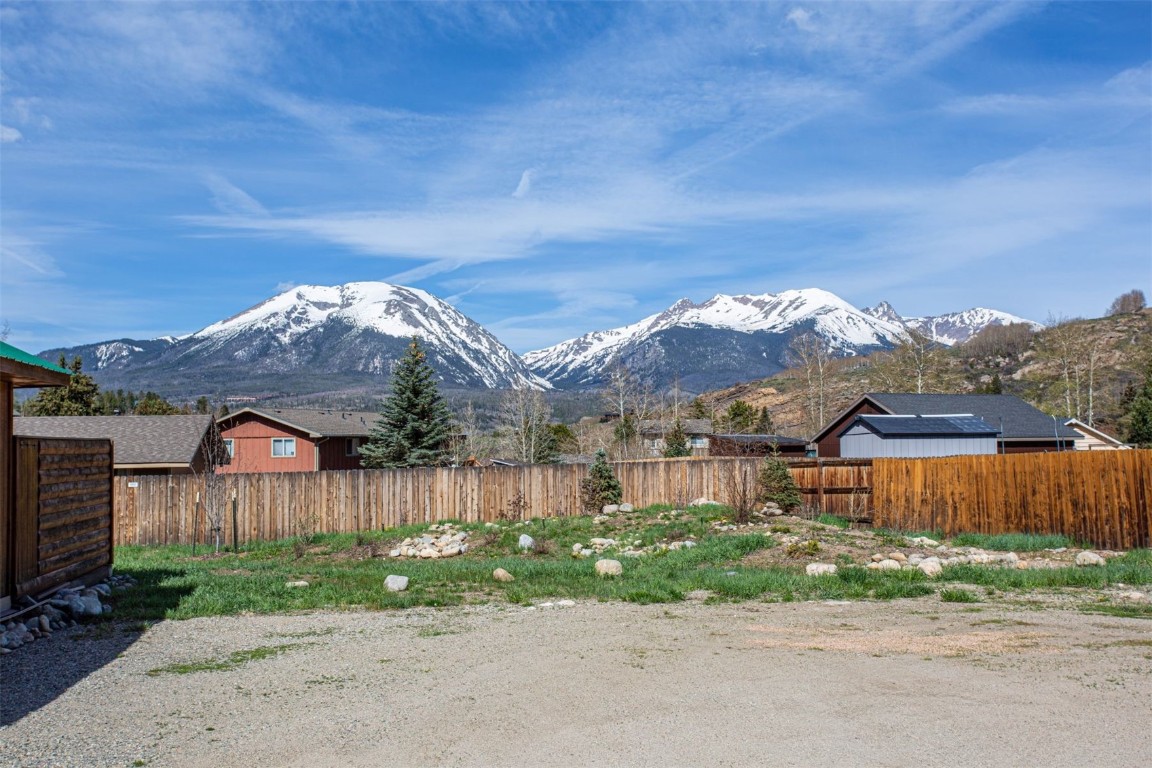 577 Deer Path Road Dillon, CO 80435 - Photo 15 of 27 a view of a house with a yard plants and wooden fence