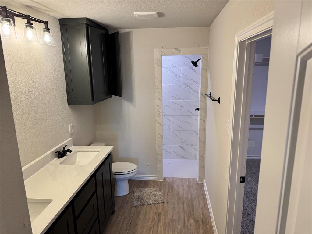 760 Smith Road Springtown, TX 76082 - Photo 6 of 9 a bathroom with a sink and mirror