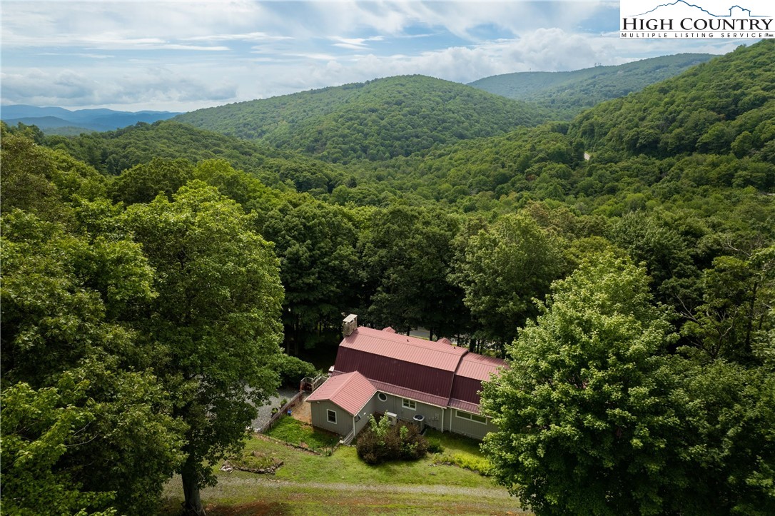 a view of a big yard with a house