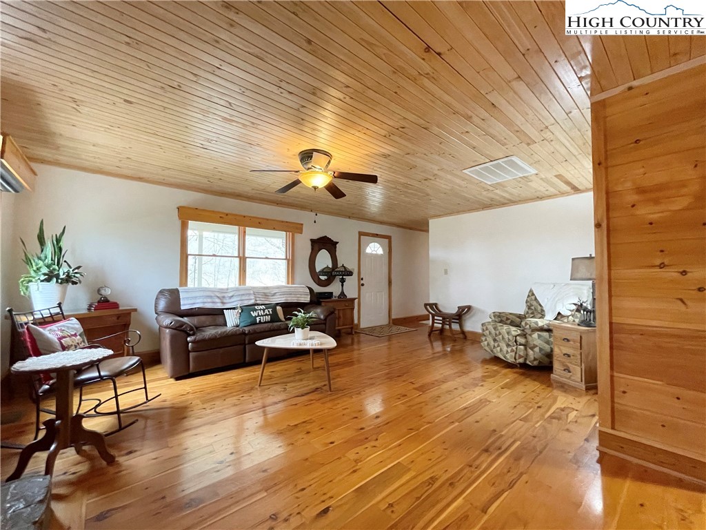 175 Woods Road Boone, NC 28607 - Photo 13 of 50 a living room with furniture and wooden floor